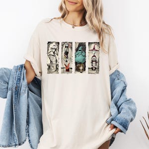 a woman wearing a t - shirt with pictures of people on it