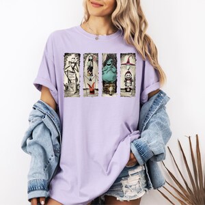 a woman wearing a purple shirt and denim jacket