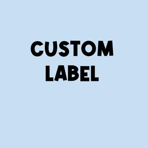 May include: A black and white text graphic on a light blue background. The text reads "CUSTOM LABEL".