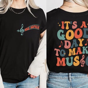 two women wearing tshirts that say it's a good day to make