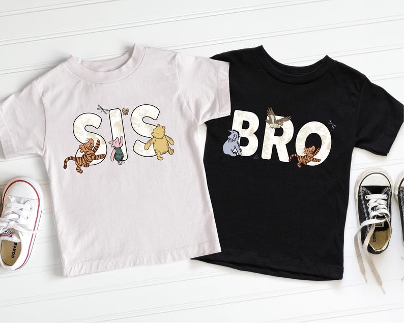 a pair of black and white tshirts with winnie the pooh on them