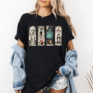 a woman wearing a black t - shirt with a star wars scene on it