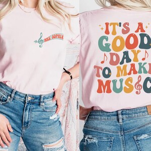 two women wearing t - shirts that say it's a good day to make