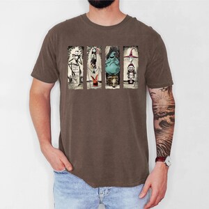 a man with a tattoo on his arm standing in front of a white wall