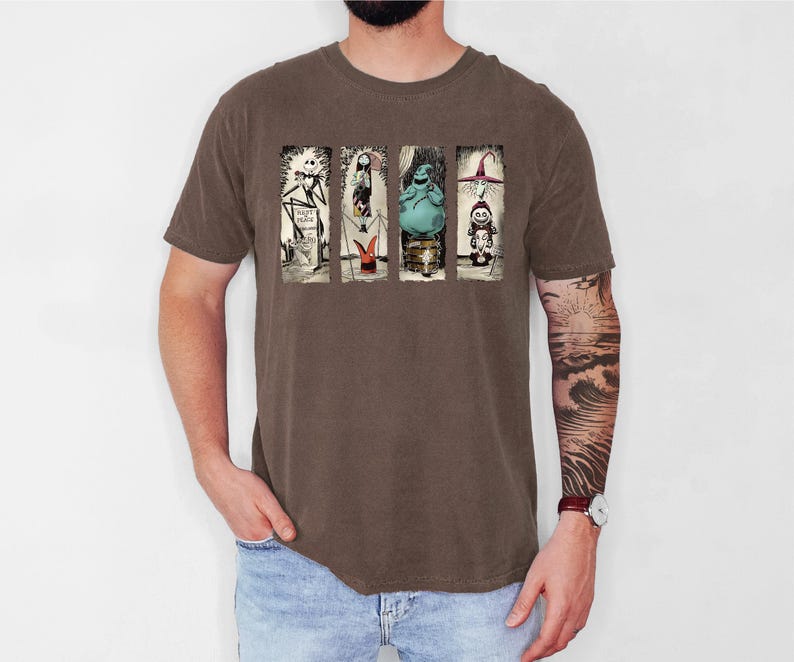 a man with a tattoo on his arm standing in front of a white wall