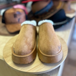 Back view of hand burned brown suede clog slippers with cozy shearling lining and faith-based design