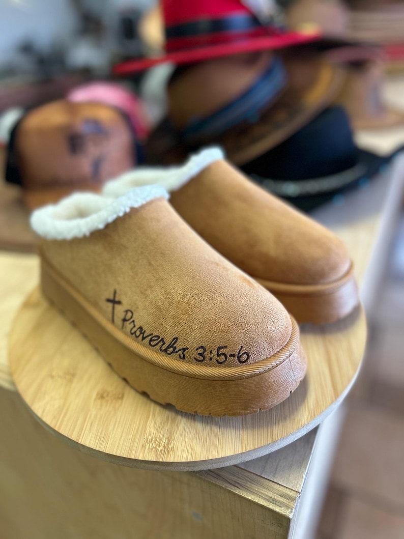 Detail of Proverbs 3:5-6 Bible verse hand burned into brown suede clog slipper with black cross accent