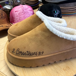 Side view of 2 Corinthians 5:7 engraved Bible verse slippers in soft tan suede, handmade and faith-based.