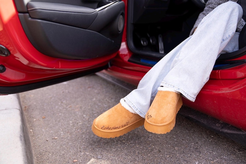 lifestyle photo of cozy scripture slippers with warm shearling lining and engraved Bible verse.