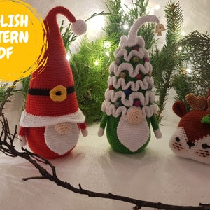 May include: Three crocheted Christmas ornaments: a red and white gnome with a white beard, a green gnome with a white tree hat, and a brown reindeer with a green holly sprig.