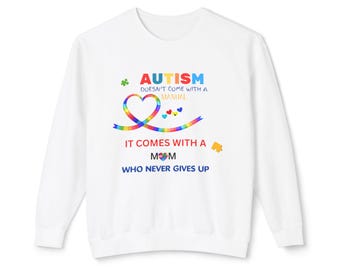 May include: White sweatshirt with a rainbow heart and the text "AUTISM DOESN'T COME WITH A MANUAL IT COMES WITH A MOM WHO NEVER GIVES UP".