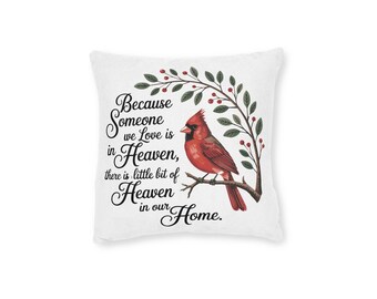 May include: White square pillow with the text "Because Someone we Love is in Heaven, there is little bit of Heaven in our Home." A red cardinal bird is perched on a branch with green leaves and red berries.