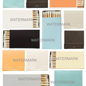 May include: A collection of matchboxes in various colors, including light blue, brown, orange, white, black, and beige. Each box is partially open, revealing the matchsticks inside. The text "WATERMARK" is printed on each box.