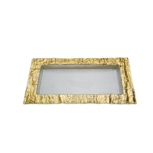 May include: A rectangular glass tray with a gold-colored, textured metal frame. The tray is empty.