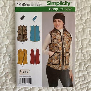 May include: A Simplicity easy-to-sew pattern for a vest. The pattern features multiple vest designs, including a paisley print vest with pockets. The pattern size is U.S. 16-24.