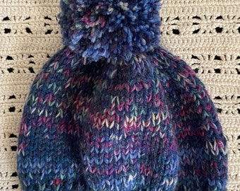 Toddler size blue hand-knit wool hat with pompom