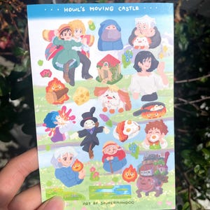 May include: A sticker sheet featuring colorful illustrations from "Howl's Moving Castle." The sheet includes various characters and elements from the movie, such as Howl, Sophie, Calcifer, and the moving castle itself. The text "Howl's Moving Castle" is at the top.