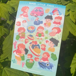 May include: A sticker sheet featuring illustrations of characters and objects from the animated film "Ponyo." The design includes a pink car, a blue fish, and various depictions of the main characters. Text at the top reads "Ponyo Little Fishy."