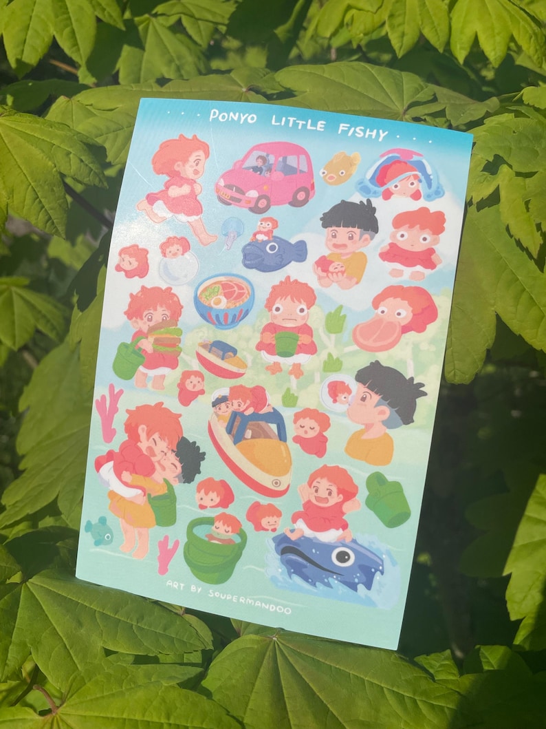 May include: A sticker sheet featuring illustrations of characters and objects from the animated film "Ponyo." The design includes a pink car, a blue fish, and various depictions of the main characters. Text at the top reads "Ponyo Little Fishy."
