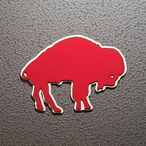 May include: A red silhouette of a buffalo, a common symbol for the city of Buffalo, New York.
