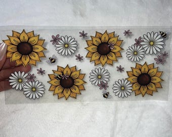 May include: A sheet of clear vinyl with multiple stickers featuring yellow sunflowers, white daisies, and small pink flowers with bees.