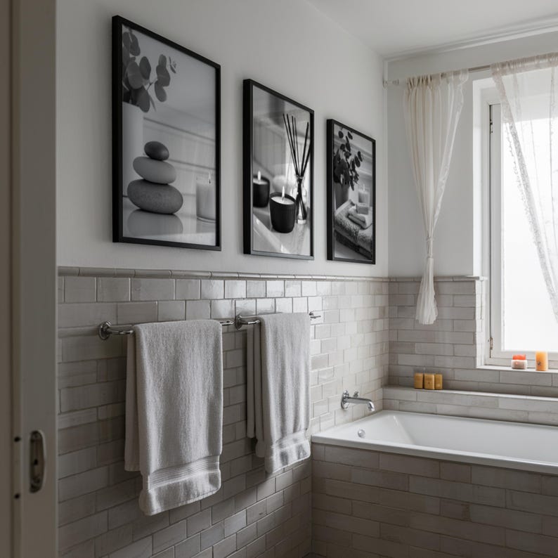 A set of 3 relaxing spa bathroom prints. Featuring minimalist black and white photography, each print showcases a calming scene with candles, towels, and soothing natural elements, displayed on the wall in a contemporary bathroom setting