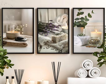 May include: A set of three framed wall art prints featuring spa-themed imagery. The left print shows a candle and stones on a towel. The center print displays lavender, soap, and a towel. The right print depicts a plant, a candle, and a bowl of herbs.