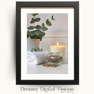 A close-up framed digital illustration of eucalyptus, a lit candle, and dried herbs resting on clean towels, photographed against a light background to highlight modern spa bathroom decor.