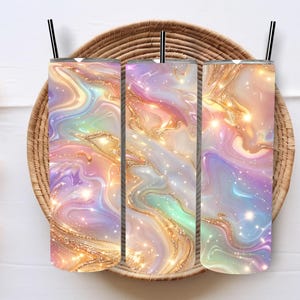 Puede incluir: Un juego de tres tazas de cerámica con un acabado mate moteado. Las tazas son de color crema, gris claro y gris oscuro. Cada taza tiene un diseño simple y minimalista y un asa redondeada.