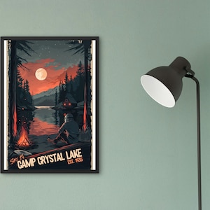 May include: A vintage-style poster with a dark blue background featuring a nighttime scene of a lake with a cabin in the distance. The lake is reflecting the light of a full moon and a campfire. The text "Stay at Camp Crystal Lake Est. 1935" is at the bottom of the poster.