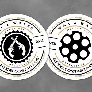 May include: Two white round stickers with black and gold designs. The stickers feature the text "Wax & Wayne Detectives Elendl Constabulary" and the numbers "0341" and "STD". One sticker has a graphic of two crossed pistols, and the other has a graphic of a revolver cylinder.