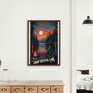 May include: A retro-style poster with a dark blue, red, and orange color scheme. It features a nighttime scene of a lake with a cabin on the shore, a campfire, and a full moon. The text on the poster reads "Stay at Camp Crystal Lake Est. 1958".