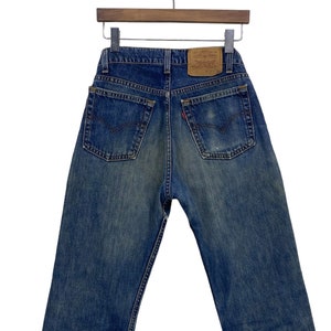 90s Vintage Levi&#39;s 519 Jeans: Medium Wash Ripped Denim, Made in USA (W30 L29.5)
