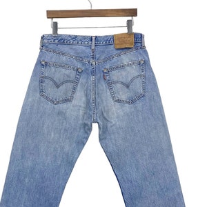 Y2K Vintage Levi&#39;s 501 Jeans: Light Wash Distressed Denim, W31 L29