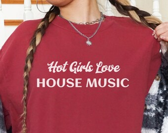 May include: Red long-sleeve t-shirt with the text "Hot Girls Love House Music" in white.
