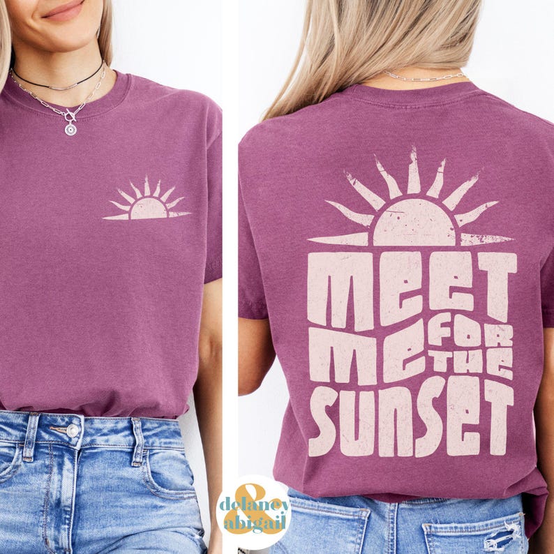 May include: A purple t-shirt with a pink sun graphic on the front and the text "Meet Me For The Sunset" on the back.