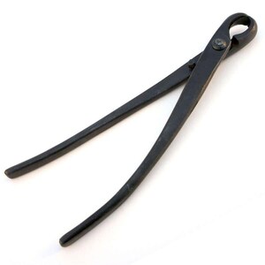 May include: Black metal bonsai shears with a curved handle and a small hole in the top of the handle.