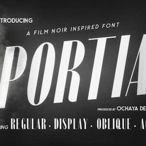 May include: A black and white image of a font called "PORTIA" with the text "NOW INTRODUCING A FILM NOIR INSPIRED FONT" above it and the text "PRRODUCED BY OCHAYA DESIGNS" and "STARRING REGULAR DISPLAY OBLIQUE. AGED" below it.