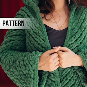 May include: A green hooded knit cardigan with a chunky texture. The word "PATTERN" is displayed on the image. The cardigan is a vibrant shade of green and appears soft and cozy.