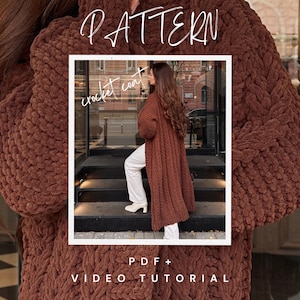 May include: A long, brown crochet coat with a textured design. The coat is worn by a person wearing white pants and shoes. The image includes the text "PATTERN", "crochet coat", "PDF + VIDEO TUTORIAL".