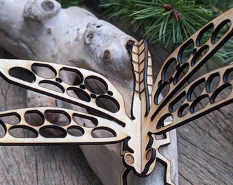 Alas susurrantes: Tranquilidad de libélula cortada con láser