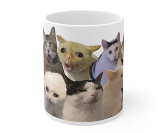 Könnte beinhalten: Weiße Keramiktasse mit einer Collage aus verschiedenen Katzenköpfen. Die Katzen haben unterschiedliche Gesichtsausdrücke, darunter überrascht, verwirrt und traurig.