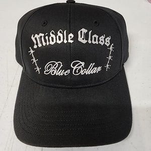 May include: Black baseball cap with white embroidered text that reads "Middle Class Blue Collar".