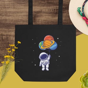 Eko-tygväska - Flytande astronaut med ballongplaneter #1
