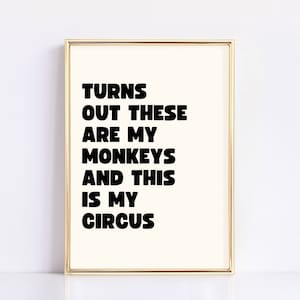 May include: A framed print with the text "TURNS OUT THESE ARE MY MONKEYS AND THIS IS MY CIRCUS" in black bold letters on a white background.