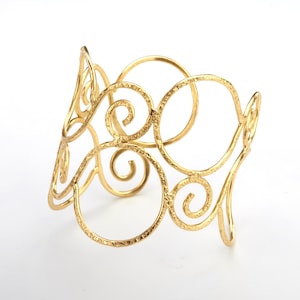 Wide textured brass wire frame cuff bracelet with swirly motif, flattened brass wire cuff