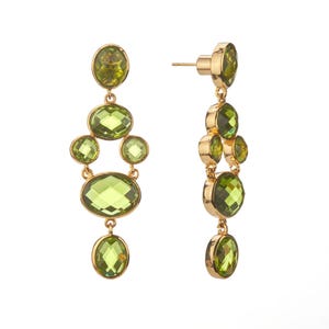 May include: A pair of gold-tone drop earrings featuring multiple faceted, oval and round olive-green stones arranged in a vertical, tiered chandelier design. The earrings include a post-back closure and exhibit a polished metallic finish throughout.