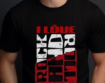 Könnte beinhalten: Schwarzes T-Shirt mit einem rot-weißen Grafikdesign. Das Design zeigt die Worte "I Love Rock and Roll" in einer kräftigen, verwitterten Schriftart. Das Shirt besteht aus einem weichen Material und hat einen klassischen Rundhalsausschnitt.