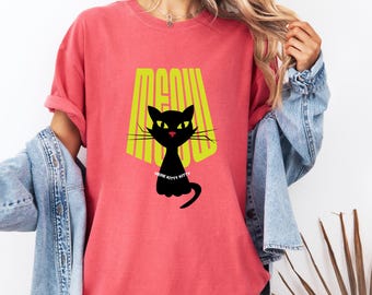 May include: A red t-shirt with a black cat graphic and the text "Meow Here Kitty Kitty" in yellow.