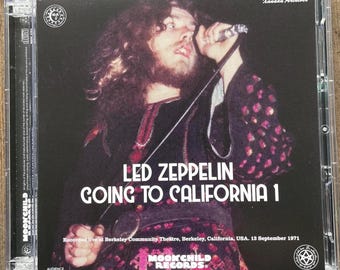 May include: A CD case featuring Led Zeppelin's "Going to California 1" album. The cover shows a live performance photo of a singer with a microphone. The text includes the band's name, album title, and recording details.